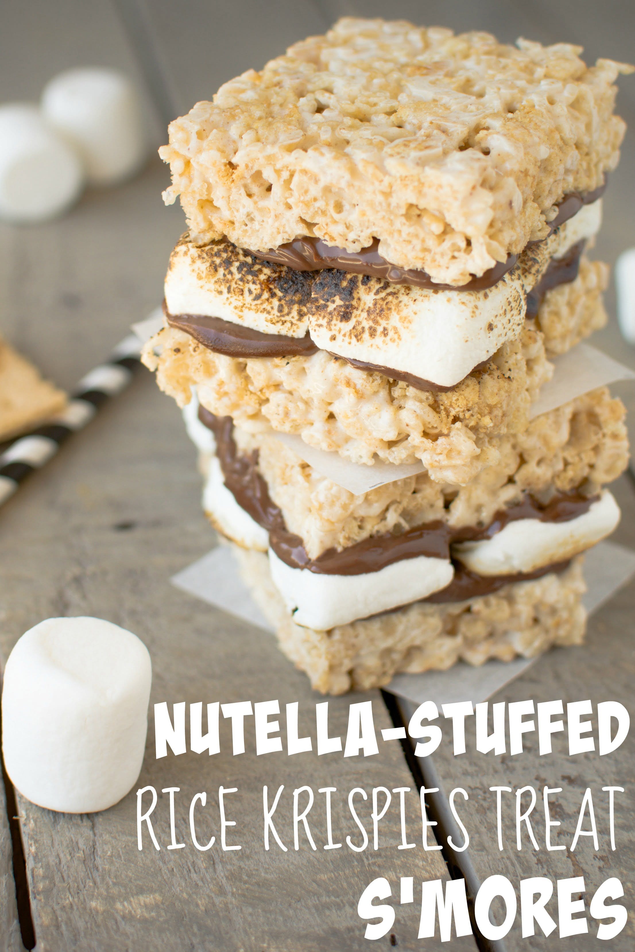 Rich, chocolatey Nutella and warm, toasty marshmallows sandwiched between brown butter rice krispies treats!