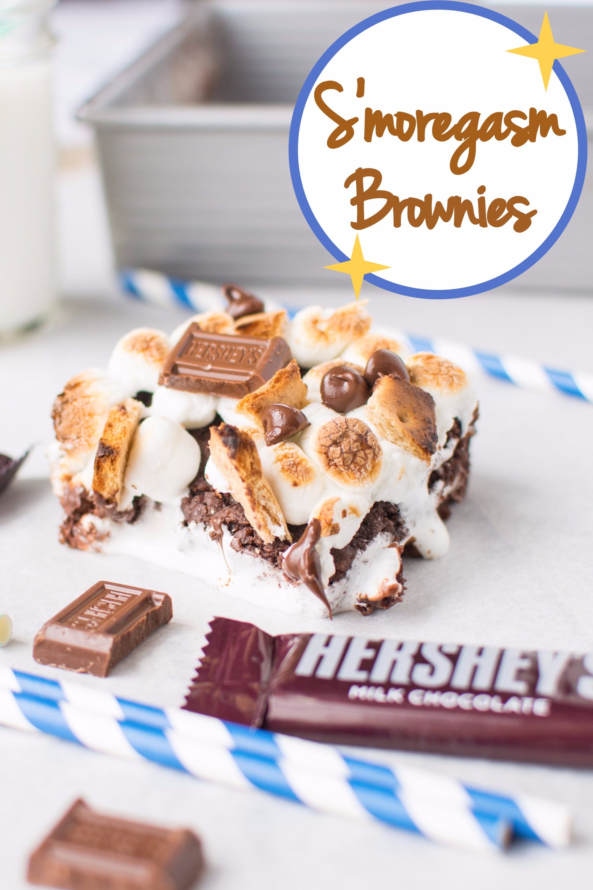 Chewy dark chocolatey brownies stuffed with ooey gooey marshmallow fluff and melty milk chocolate, topped with golden-roasted marshmallows, toasted graham crackers, and extra milk chocolate!