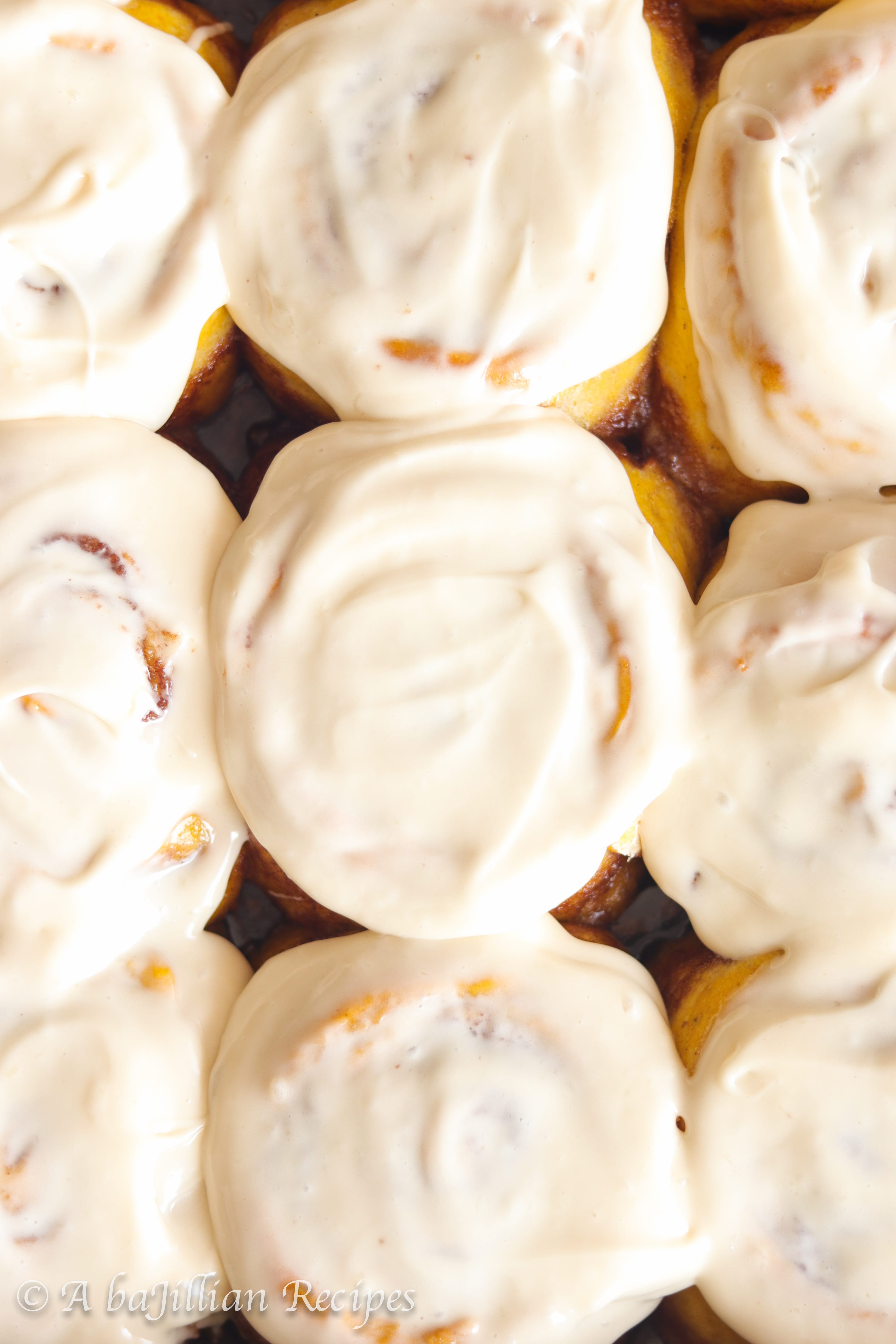 Soft and incredibly doughy pumpkin cinnamon rolls topped with rich and velvety maple cream cheese icing!