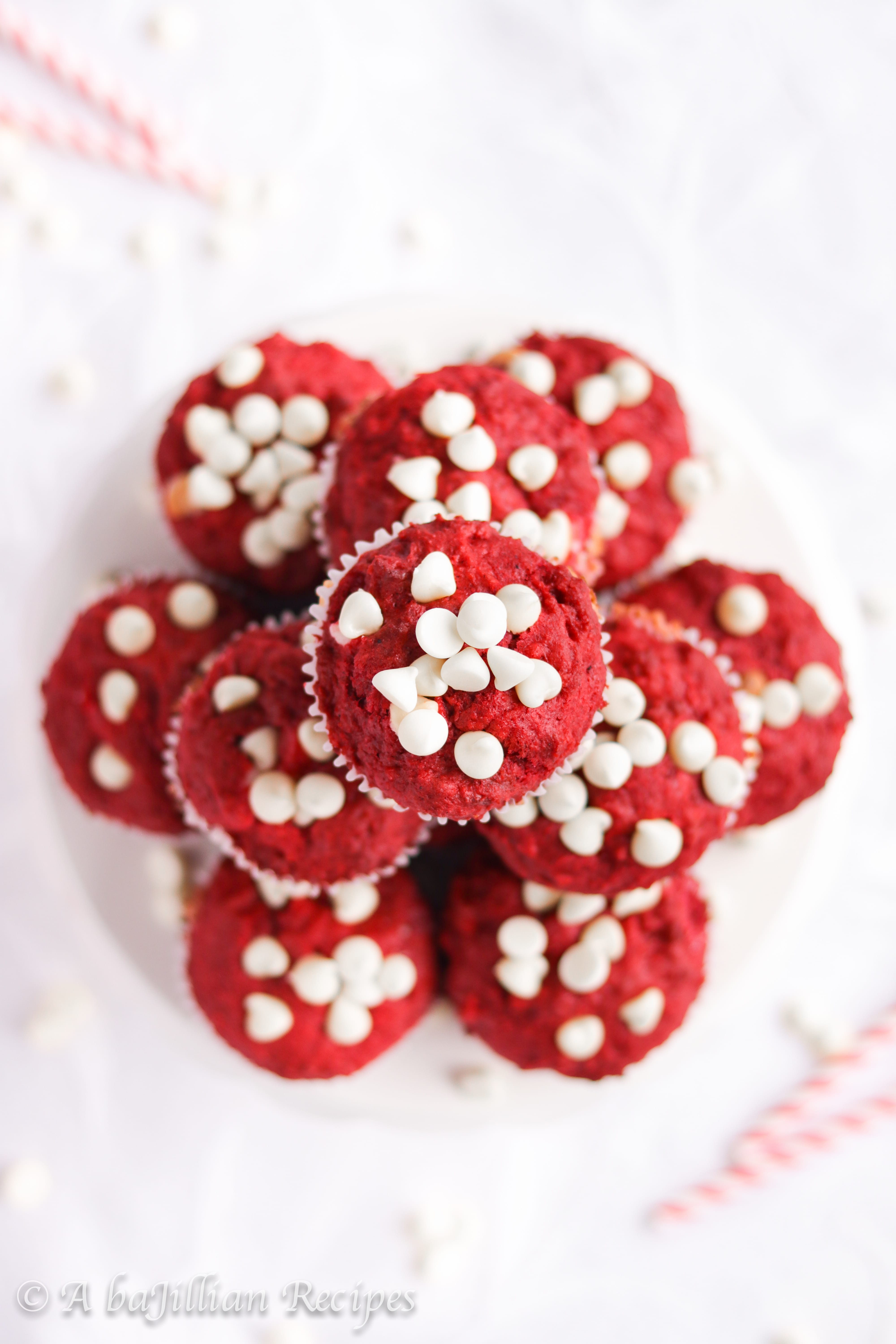 Moist and fluffy red velvet muffins loaded with white chocolate chips and filled with a sweetened cream cheese center!