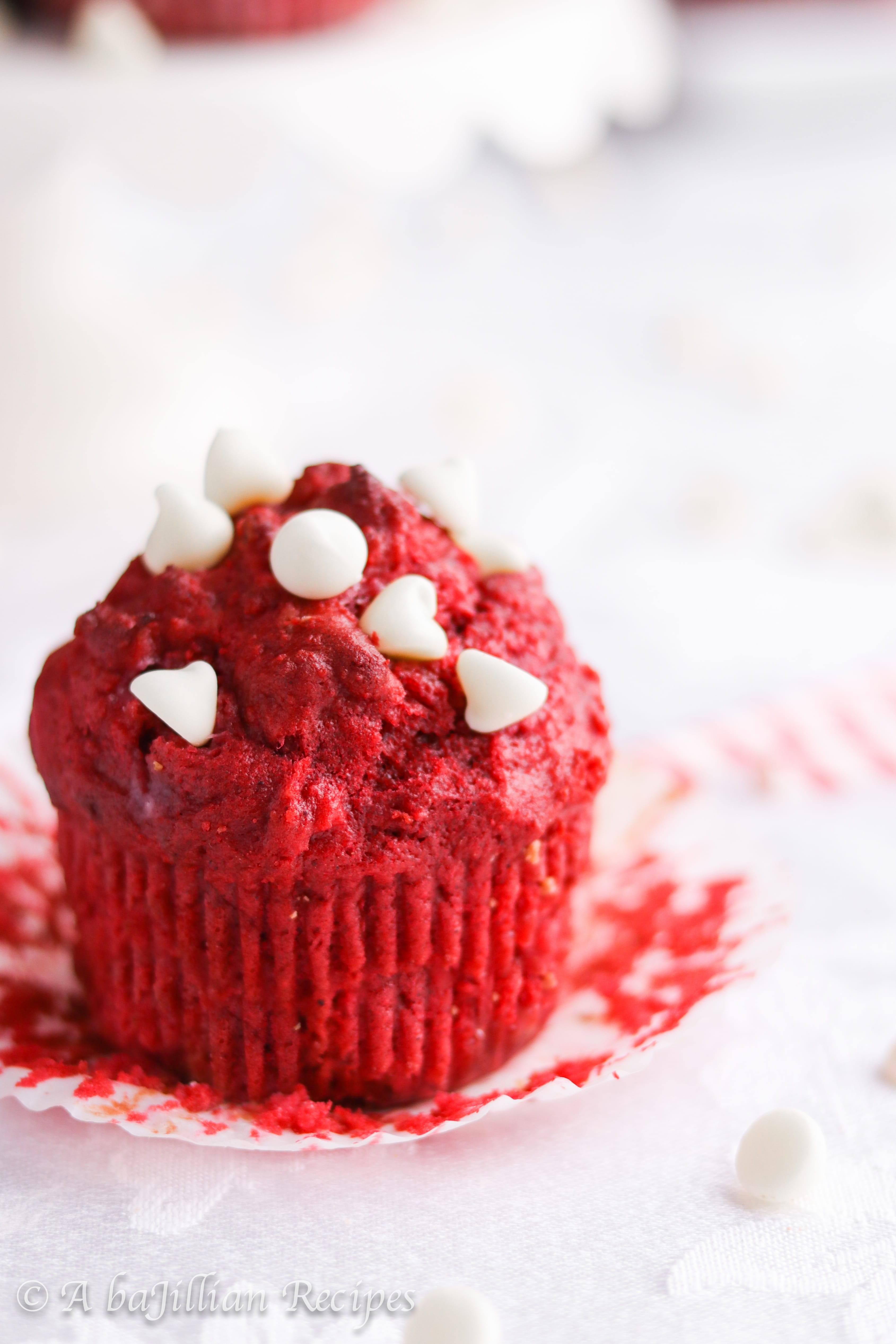 Moist and fluffy red velvet muffins loaded with white chocolate chips and filled with a sweetened cream cheese center!